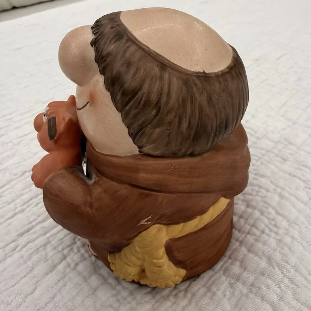 Wind-Up Ziggy Cartoon Figurine Smiling Padre Holding Dog Ceramic/Wood Brown